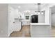 Modern kitchen featuring stainless steel appliances, white cabinets, stylish backsplash, and ample counter space at 2554 Gordon Se Cir, Smyrna, GA 30080