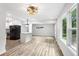 Bright and spacious living room features lots of windows and hardwood floors, adjacent to a modern kitchen at 2554 Gordon Se Cir, Smyrna, GA 30080