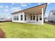 Backyard with a covered patio and freshly laid sod at 235 Strawberry Ln, Woodstock, GA 30189