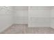Walk-in closet with carpet and wire shelving at 235 Strawberry Ln, Woodstock, GA 30189