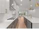 A gourmet kitchen features quartz countertops, stainless appliances, and pendant lighting at 235 Strawberry Ln, Woodstock, GA 30189