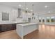 Stylish open-concept kitchen featuring a center island and modern stainless steel appliances at 235 Strawberry Ln, Woodstock, GA 30189