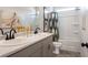 Bright bathroom featuring a double sink vanity, a neutral color scheme and tub with shower at 26 Kensington St, Kingston, GA 30145
