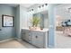 Bathroom featuring double sinks, grey cabinets, and a modern design at 26 Kensington St, Kingston, GA 30145