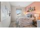 Bright bedroom with a unique wall decor, large window and modern furnishings at 26 Kensington St, Kingston, GA 30145