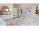 Stylized bedroom with floral bedding, modern dresser, and decor at 26 Kensington St, Kingston, GA 30145