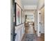 Inviting hallway with hardwood floors, decorative wall trim, and an open view to the spacious living room at 26 Kensington St, Kingston, GA 30145