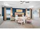 Spacious main bedroom with a tray ceiling, dark accent wall, and sitting area at 26 Kensington St, Kingston, GA 30145