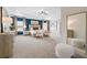 Spacious primary bedroom with tray ceilings, plush carpet, large windows and designer furniture at 26 Kensington St, Kingston, GA 30145