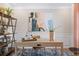 Home office with neutral walls, large window, decor, and built in shelving unit at 26 Kensington St, Kingston, GA 30145