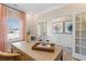 Home office with large window, glass doors, decor, and an executive desk at 26 Kensington St, Kingston, GA 30145