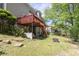 Backyard featuring a wooden deck with stairs and a fire pit at 2945 Barimore Pl, Dacula, GA 30019