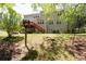 Expansive backyard with lush greenery and a charming wooden deck with stairs at 2945 Barimore Pl, Dacula, GA 30019