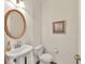 Cozy half bathroom featuring neutral paint and an oval mirror at 2945 Barimore Pl, Dacula, GA 30019