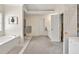 Bright bathroom with soaking tub, neutral tones, and lots of space to move around at 2945 Barimore Pl, Dacula, GA 30019