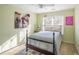 Charming bedroom with a bed, artwork, and an abundance of natural light at 2945 Barimore Pl, Dacula, GA 30019