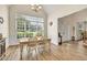 Sunlit dining area with large window and laminate flooring at 2945 Barimore Pl, Dacula, GA 30019