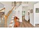 Inviting foyer with staircase, hardwood floors, and elegant decor at 2945 Barimore Pl, Dacula, GA 30019