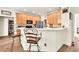 Updated kitchen featuring modern appliances, breakfast bar seating, and access to a pantry at 2945 Barimore Pl, Dacula, GA 30019