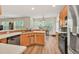 Bright kitchen featuring stainless steel appliances, light wood cabinets, and light countertops at 2945 Barimore Pl, Dacula, GA 30019