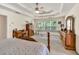 Inviting main bedroom with tray ceiling, natural light, and views of surrounding trees at 2945 Barimore Pl, Dacula, GA 30019