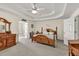 Luxurious main bedroom boasts a tray ceiling, wooden furniture, and elegant finishes at 2945 Barimore Pl, Dacula, GA 30019
