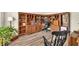 Spacious office with built-in wooden bookshelves and laminate flooring at 2945 Barimore Pl, Dacula, GA 30019