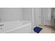 Bright bathroom with a built-in tub and separate shower, offering a clean and modern space at 3203 Cyrus Point Nw Ln, Kennesaw, GA 30152