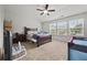 Bedroom featuring a ceiling fan and natural light from the three large windows at 3203 Cyrus Point Nw Ln, Kennesaw, GA 30152