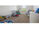 Inviting bedroom featuring carpet, a crib and rocking chair, and plenty of natural light at 3203 Cyrus Point Nw Ln, Kennesaw, GA 30152