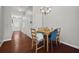 Cozy dining area with wood table, chandelier, and hardwood floors at 3203 Cyrus Point Nw Ln, Kennesaw, GA 30152