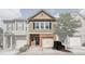 Charming townhome with a brick facade, attached garage, and well-maintained landscaping at 3203 Cyrus Point Nw Ln, Kennesaw, GA 30152