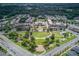 Aerial view of a meticulously planned community with green spaces, shops, and homes at 4236 Tacoma Trce, Suwanee, GA 30024