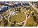 Overhead view of the town center's amphitheater and lawn surrounded by community amenities at 4236 Tacoma Trce, Suwanee, GA 30024