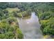Aerial view of lake surrounded by trees at 4236 Tacoma Trce, Suwanee, GA 30024