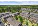 Aerial view showcasing a vibrant community with well-maintained landscaping and various styles of homes at 4236 Tacoma Trce, Suwanee, GA 30024