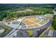 An aerial view of a park with water features, parking, and a wooded area in the background at 4236 Tacoma Trce, Suwanee, GA 30024