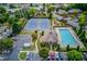 Community aerial view showcases tennis courts, playground, pool, and clubhouse nestled in lush landscaping at 4236 Tacoma Trce, Suwanee, GA 30024