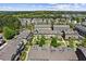 Aerial view of a suburban neighborhood featuring well-maintained townhomes and lush green spaces at 4236 Tacoma Trce, Suwanee, GA 30024