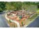 Aerial view of fenced community playground with climbing structures and slides at 4236 Tacoma Trce, Suwanee, GA 30024