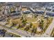 Aerial view showcases a vibrant community with green spaces and charming townhomes at 4236 Tacoma Trce, Suwanee, GA 30024