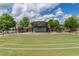 Outdoor amphitheater at Suwanee Town Center with tiered grass seating and a covered stage area at 4236 Tacoma Trce, Suwanee, GA 30024