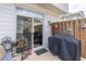 Private back patio with a grill, potted plants, and a privacy fence, ideal for outdoor entertaining at 4236 Tacoma Trce, Suwanee, GA 30024