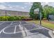 A community basketball court provides opportunities for fun and exercise at 4236 Tacoma Trce, Suwanee, GA 30024