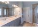 Elegant bathroom with double vanity, spacious shower, and soaking tub for a spa-like experience at 4236 Tacoma Trce, Suwanee, GA 30024