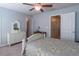 Cozy bedroom with dresser and closet features a ceiling fan and two entryways at 4236 Tacoma Trce, Suwanee, GA 30024