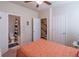 Another view of bedroom with a ceiling fan, and multiple entryways at 4236 Tacoma Trce, Suwanee, GA 30024