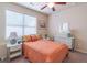 Bright bedroom with cozy blanket, framed wall art, a large window, and natural light at 4236 Tacoma Trce, Suwanee, GA 30024