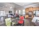 A common room with a kitchen, dining area, living area, modern furnishings and ample seating at 4236 Tacoma Trce, Suwanee, GA 30024
