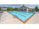 A view of the community pool with lounge chairs for relaxing by the water at 4236 Tacoma Trce, Suwanee, GA 30024